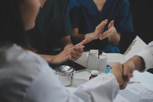Doctor handshake and partnership in healthcare, medicine or trust for collaboration, unity or support.Team of medical experts shaking hands in teamwork for or success in hospital photo