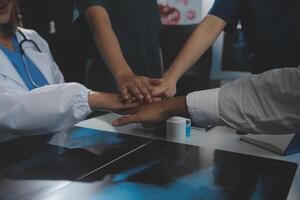 Doctor handshake and partnership in healthcare, medicine or trust for collaboration, unity or support.Team of medical experts shaking hands in teamwork for or success in hospital photo