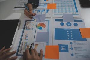 Business team collaboration discussing working analyzing with financial data and marketing growth report graph in team, presentation and brainstorming to strategy planning making profit of company. photo