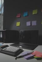 Studio workspace with laptop computer and office supplies. Work from home. With copy space photo
