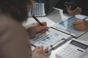 Business team collaboration discussing working analyzing with financial data and marketing growth report graph in team, presentation and brainstorming to strategy planning making profit of company. photo