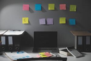 Studio workspace with laptop computer and office supplies. Work from home. With copy space photo