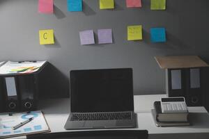 Studio workspace with laptop computer and office supplies. Work from home. With copy space photo