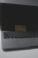 Calculator on a dark background, plastic cards and banknotes photo