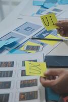 ux Graphic designer creative sketch planning application process development prototype wireframe for web mobile phone . User experience concept. photo