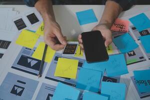 ux Graphic designer creative sketch planning application process development prototype wireframe for web mobile phone . User experience concept. photo