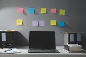 Studio workspace with laptop computer and office supplies. Work from home. With copy space photo