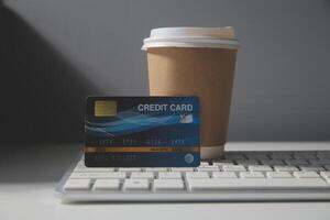 Calculator on a dark background, plastic cards and banknotes photo
