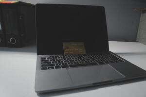 Calculator on a dark background, plastic cards and banknotes photo