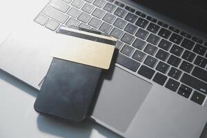 Calculator on a dark background, plastic cards and banknotes photo