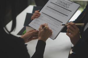 Business Signing a Contract Buy - sell house, insurance agent analyzing about home investment loan Real Estate concept. photo