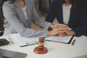 Lawyer, legal advisor, businessman brainstorming information on agreement details Business contracts in legal processing books for accuracy in contract documents. joint financial investment. photo