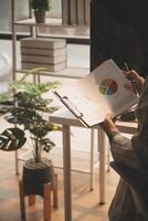 Team of business people working together in the meeting room office, teamwork background charts and graphs banner, double exposure successful teamwork,business planning concept. photo