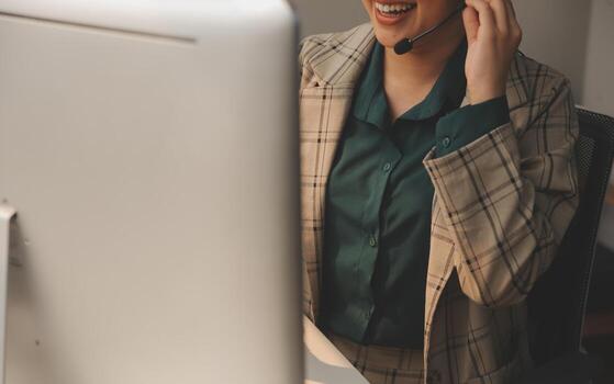 Call center, computer and business with woman in office for customer service, technical support and advice. Technology, contact us and communication with employee operator in help desk agency photo