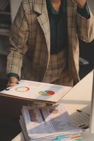 Team of business people working together in the meeting room office, teamwork background charts and graphs banner, double exposure successful teamwork,business planning concept. photo