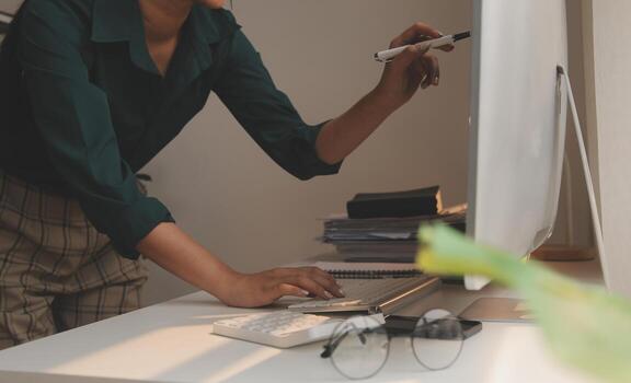 Call center, computer and business with woman in office for customer service, technical support and advice. Technology, contact us and communication with employee operator in help desk agency photo