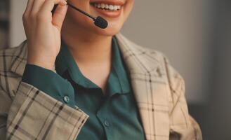 Call center, computer and business with woman in office for customer service, technical support and advice. Technology, contact us and communication with employee operator in help desk agency photo