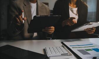 Team of business people working together in the meeting room office, teamwork background charts and graphs banner, double exposure successful teamwork,business planning concept. photo