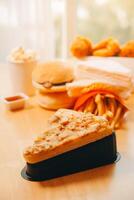Multiple type of Fast food on table. photo