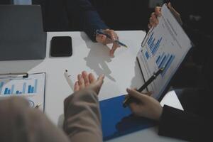 Business team collaboration discussing working analyzing with financial data and marketing growth report graph in team, presentation and brainstorming to strategy planning making profit of company. photo