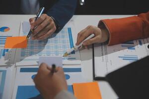 Business team collaboration discussing working analyzing with financial data and marketing growth report graph in team, presentation and brainstorming to strategy planning making profit of company. photo