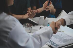 Doctor handshake and partnership in healthcare, medicine or trust for collaboration, unity or support.Team of medical experts shaking hands in teamwork for or success in hospital photo