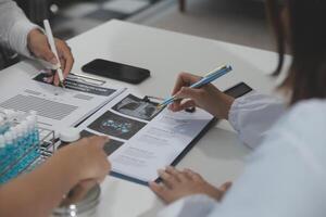 Group of professional medical doctor team meeting training medical in uniform working discussing and talk with patients record, teaching medic team, sit in hospital.health medical care concept photo