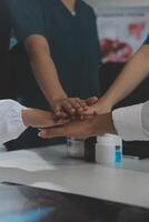 Doctor handshake and partnership in healthcare, medicine or trust for collaboration, unity or support.Team of medical experts shaking hands in teamwork for or success in hospital photo