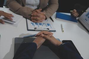 Business team collaboration discussing working analyzing with financial data and marketing growth report graph in team, presentation and brainstorming to strategy planning making profit of company. photo