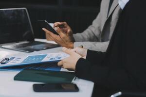 Business team present. Business man hands hold documents with financial statistic stock photo, discussion, and analysis report data the charts and graphs. Finance concept photo