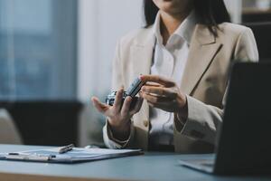 Business car rental company service, Close up hand of agent dealer giving, holding car key to customer renter, new owner after signed rental, purchase contract in document, vehicle sales agreement. photo