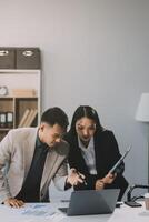 Two happy friendly diverse professionals, teacher and student giving high five standing in office celebrating success, good cooperation result, partnership teamwork and team motivation in office work. photo