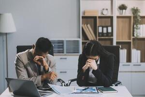 Manager is hard talking with employee in an office. Businessmen arguing at workplace, disagreeing over document, partners having conflict while negotiating, business deal failure photo