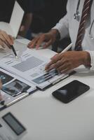 Group of professional medical doctor team meeting training medical in uniform working discussing and talk with patients record, teaching medic team, sit in hospital.health medical care concept photo