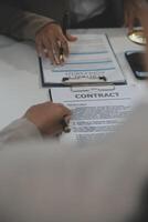 Judge gavel with Justice lawyers having team meeting at law firm background. Concepts of Law and Legal services. photo