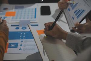 Business team collaboration discussing working analyzing with financial data and marketing growth report graph in team, presentation and brainstorming to strategy planning making profit of company. photo