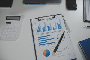Business team collaboration discussing working analyzing with financial data and marketing growth report graph in team, presentation and brainstorming to strategy planning making profit of company. photo