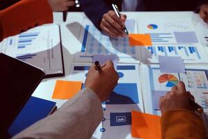 Business team collaboration discussing working analyzing with financial data and marketing growth report graph in team, presentation and brainstorming to strategy planning making profit of company. photo