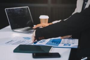 Business team present. Business man hands hold documents with financial statistic stock photo, discussion, and analysis report data the charts and graphs. Finance concept photo