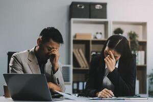 Manager is hard talking with employee in an office. Businessmen arguing at workplace, disagreeing over document, partners having conflict while negotiating, business deal failure photo