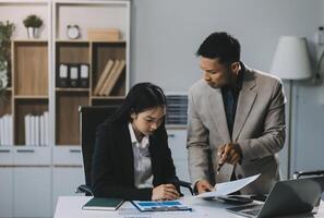 Manager is hard talking with employee in an office. Businessmen arguing at workplace, disagreeing over document, partners having conflict while negotiating, business deal failure photo
