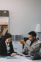 Manager is hard talking with employee in an office. Businessmen arguing at workplace, disagreeing over document, partners having conflict while negotiating, business deal failure photo