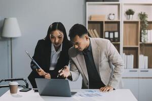 Two happy friendly diverse professionals, teacher and student giving high five standing in office celebrating success, good cooperation result, partnership teamwork and team motivation in office work. photo