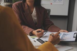 Team of business people working together in the meeting room office, teamwork background charts and graphs banner, double exposure successful teamwork,business planning concept. photo