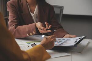 Team of business people working together in the meeting room office, teamwork background charts and graphs banner, double exposure successful teamwork,business planning concept. photo