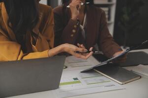 Team of business people working together in the meeting room office, teamwork background charts and graphs banner, double exposure successful teamwork,business planning concept. photo