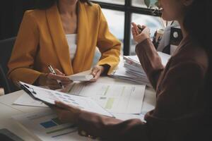 Team of business people working together in the meeting room office, teamwork background charts and graphs banner, double exposure successful teamwork,business planning concept. photo