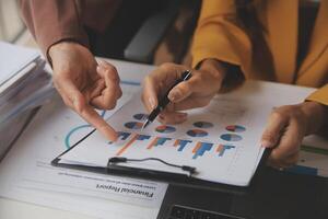 Team of business people working together in the meeting room office, teamwork background charts and graphs banner, double exposure successful teamwork,business planning concept. photo