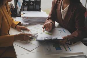 Team of business people working together in the meeting room office, teamwork background charts and graphs banner, double exposure successful teamwork,business planning concept. photo