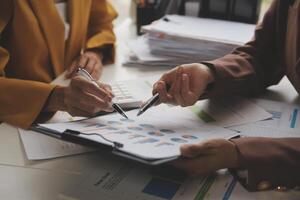 Team of business people working together in the meeting room office, teamwork background charts and graphs banner, double exposure successful teamwork,business planning concept. photo
